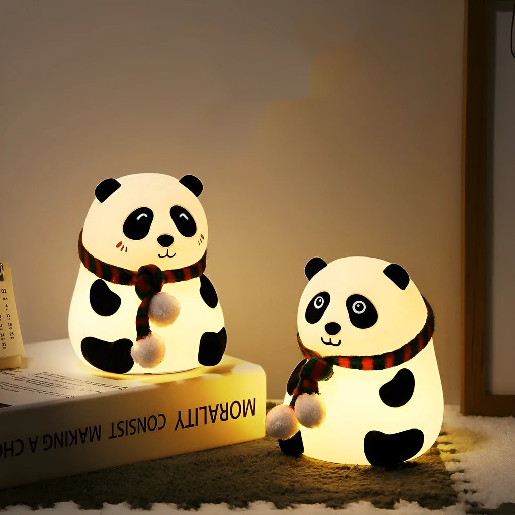 Panda-shaped soft silicone night light with USB rechargeable battery on a table.