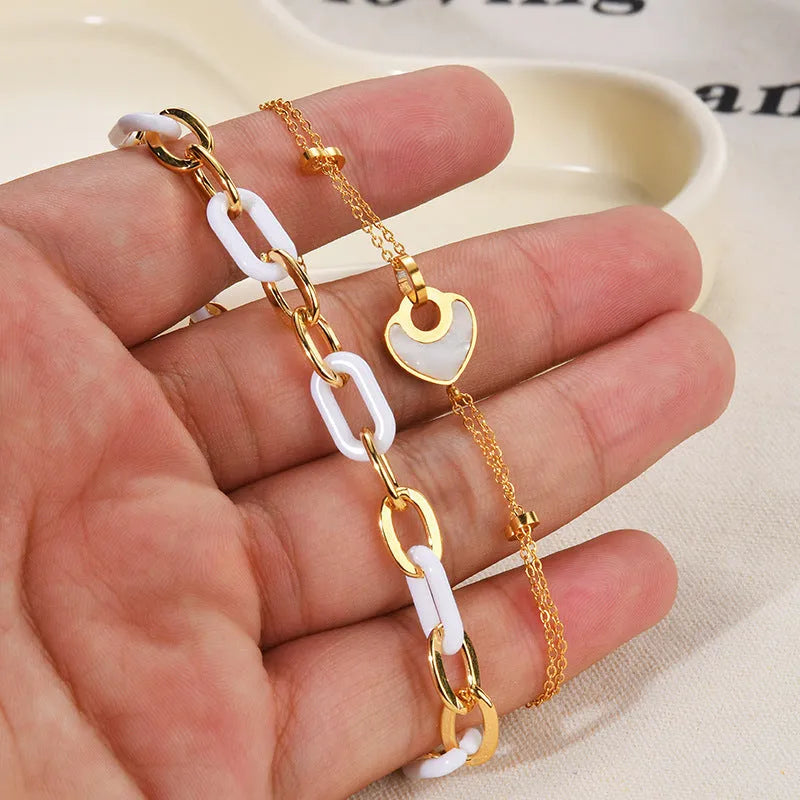 Women's stainless steel resin bracelet with double-layer loving heart design and heart-shaped pendant