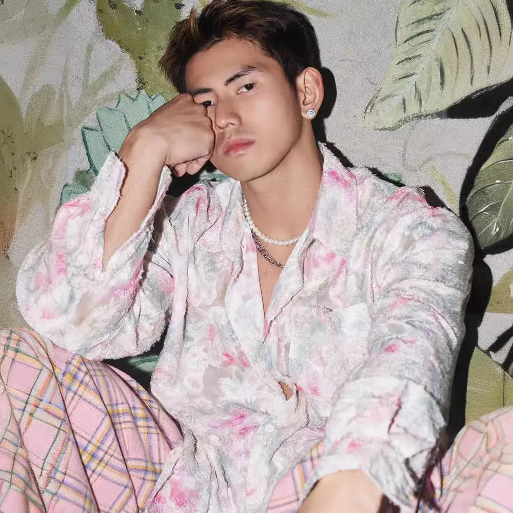 Pink floral long sleeve shirt with a three-dimensional embossed pattern and a loose fit.