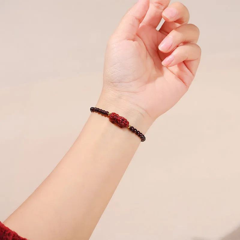 Square garnet bracelet with Pixiu carving in purple sand colour