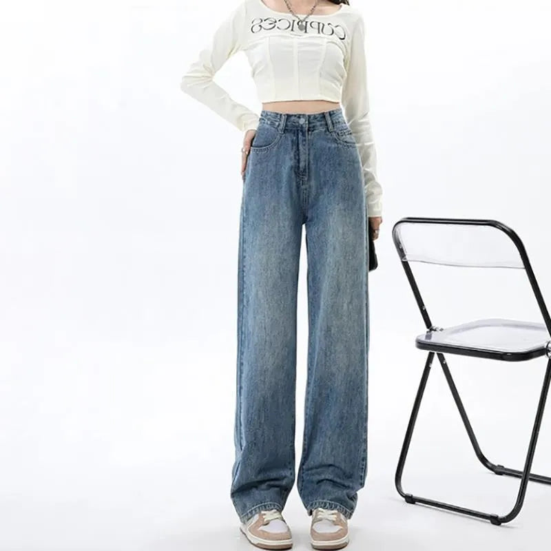 Women's retro blue high waist wide leg jeans on a hanger, showing straight cut and front button detail.