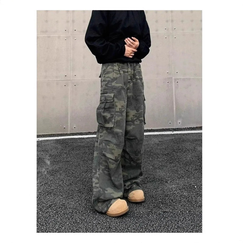 Korean style washed camouflage cargo trousers with multiple pockets on a mid-waist fit.