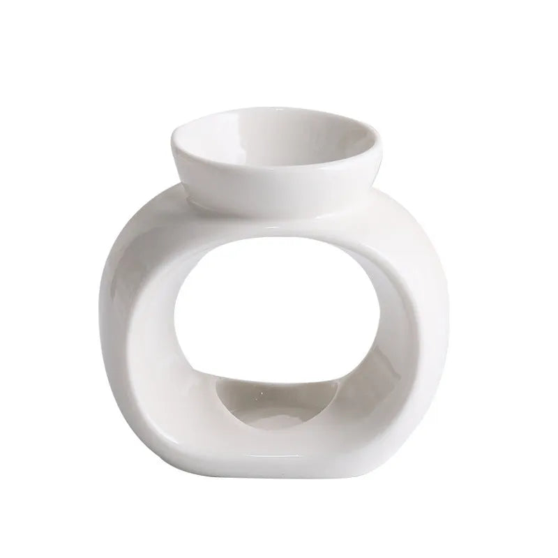 White Nordic style porcelain aromatherapy stove ornament on plain background