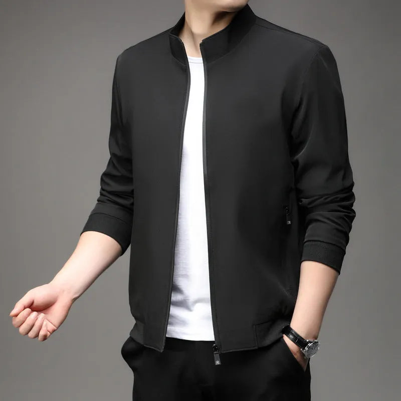 Korean style loose fit autumn jacket in navy blue with zippered pockets on a hanger