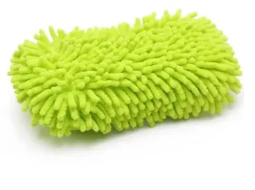 Silvery green chenille microfiber car wash sponge on a car bonnet.