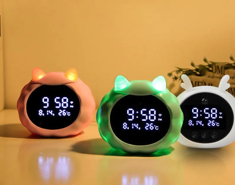 Smart digital alarm clock with silicone casing featuring voice control and a motion sensor.