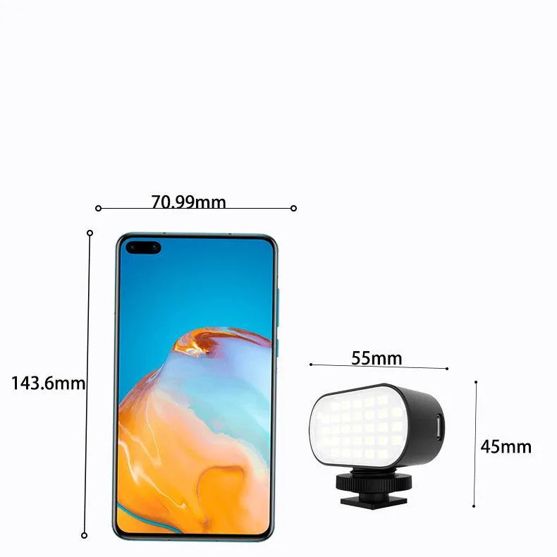 Black ST-30 handheld mobile phone fill light unit with diffuser and colour palettes.