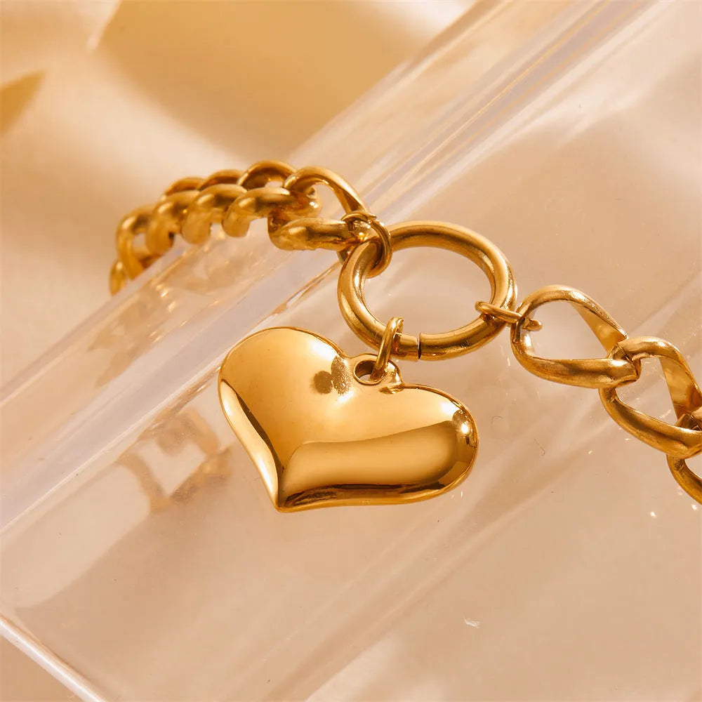 Titanium steel metal bracelet with round chain and heart detail in gold N510 colour