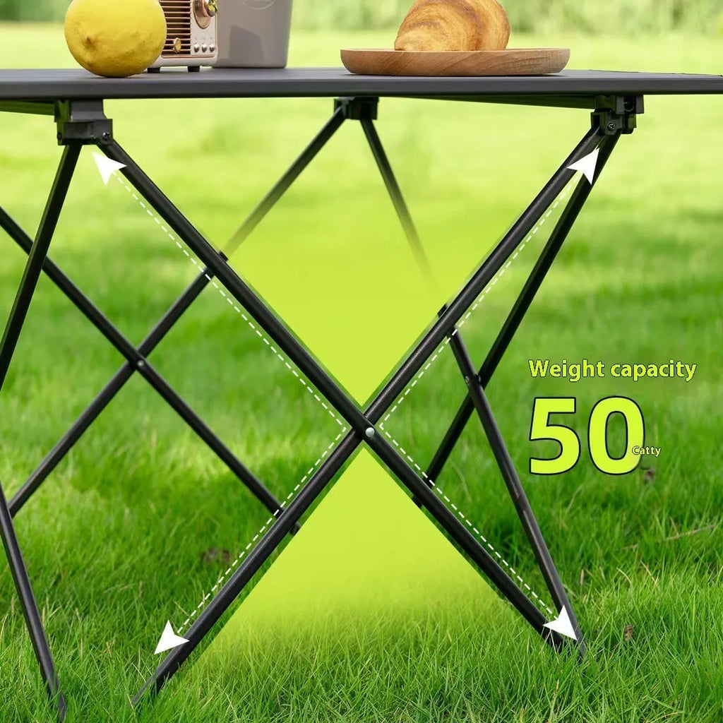 Ultralight aluminium alloy folding table in black carbon steel finish, folded flat for storage