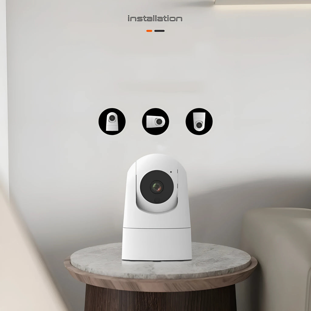 White indoor 5G security camera with tilt head on a desk next to EU UK US power plugs.