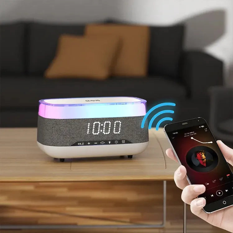 White alarm clock with wireless charging surface and Bluetooth speaker functionality for bedside use