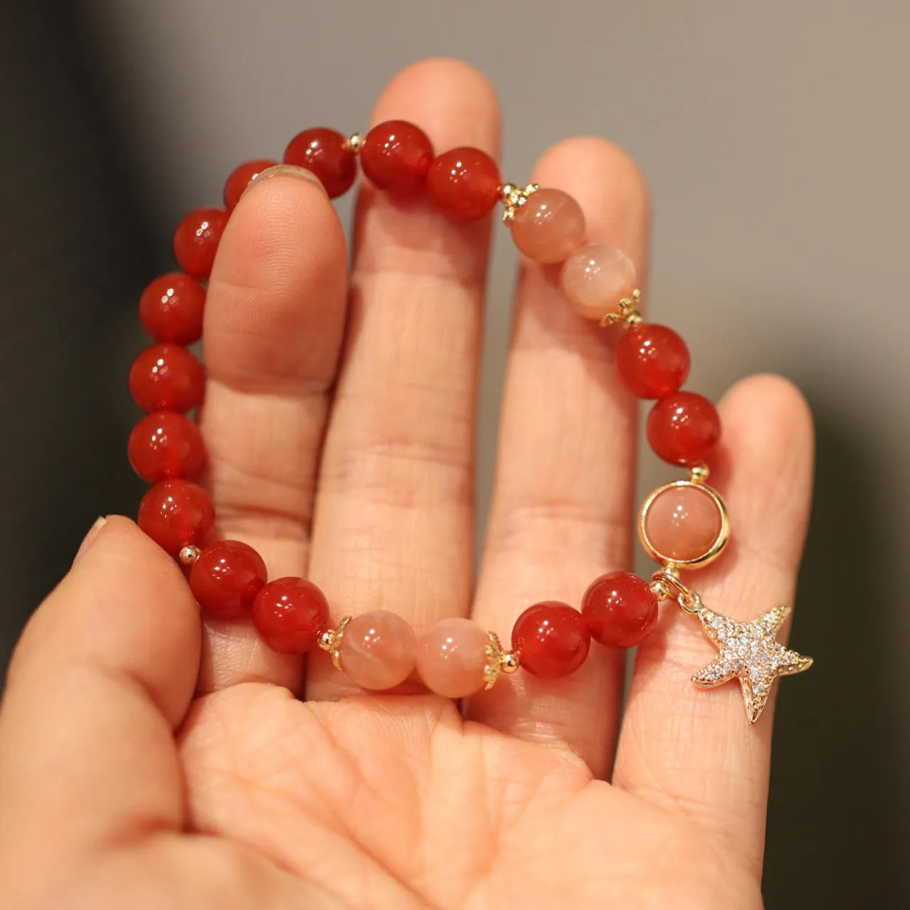 Handmade women's bracelet with 8mm red agate and sunstone beads in ethnic Xiangyun style