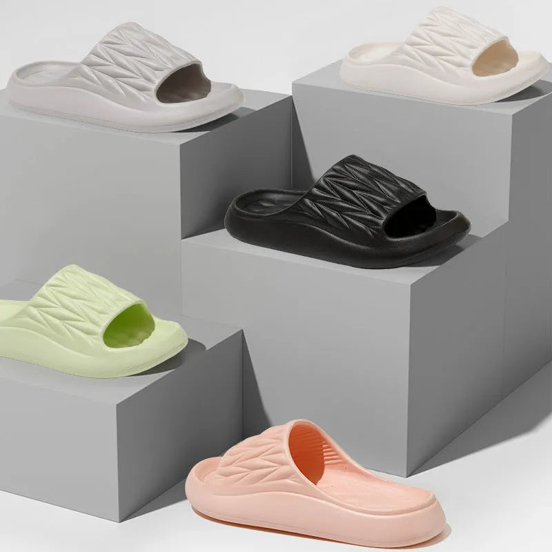 Leaf texture pattern EVA foam slippers for men and women in various colours on a white background.