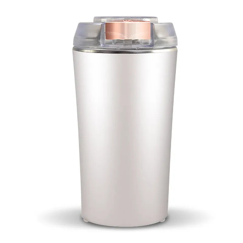 Blue mini electric flour mill grinder with stainless steel construction on a kitchen countertop