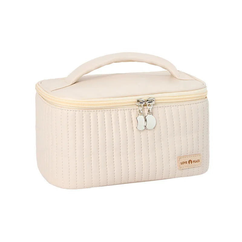 Open-top women's makeup bag in solid-colour PU leather, shown in beige.