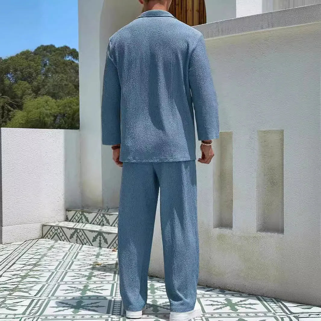 Men's casual polyester commuter suit in lake blue, showing shirt jacket and trousers laid flat.