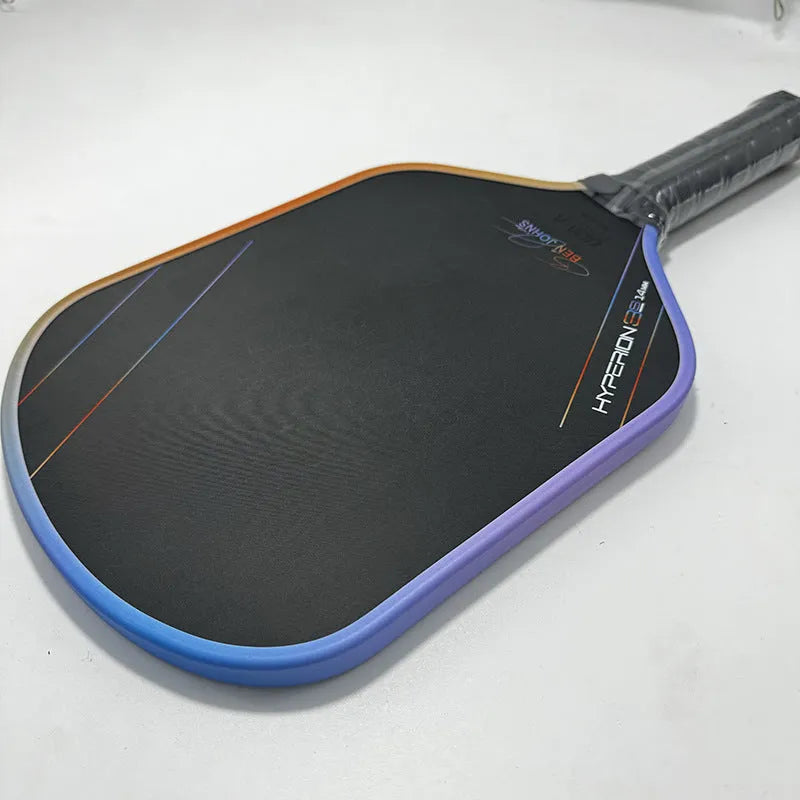Aurora Multicolor Hyperion 3s pickleball racket with matte Teflon pattern carbon fibre face.