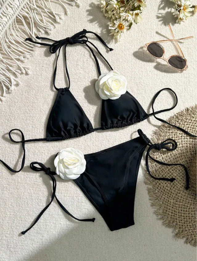 Black women's bikini set with 3D flower patterns, drawstring waist, and backless briefs design