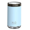 White portable USB humidifier emitting jellyfish-shaped smoke rings with a warm glowing night light on a desk