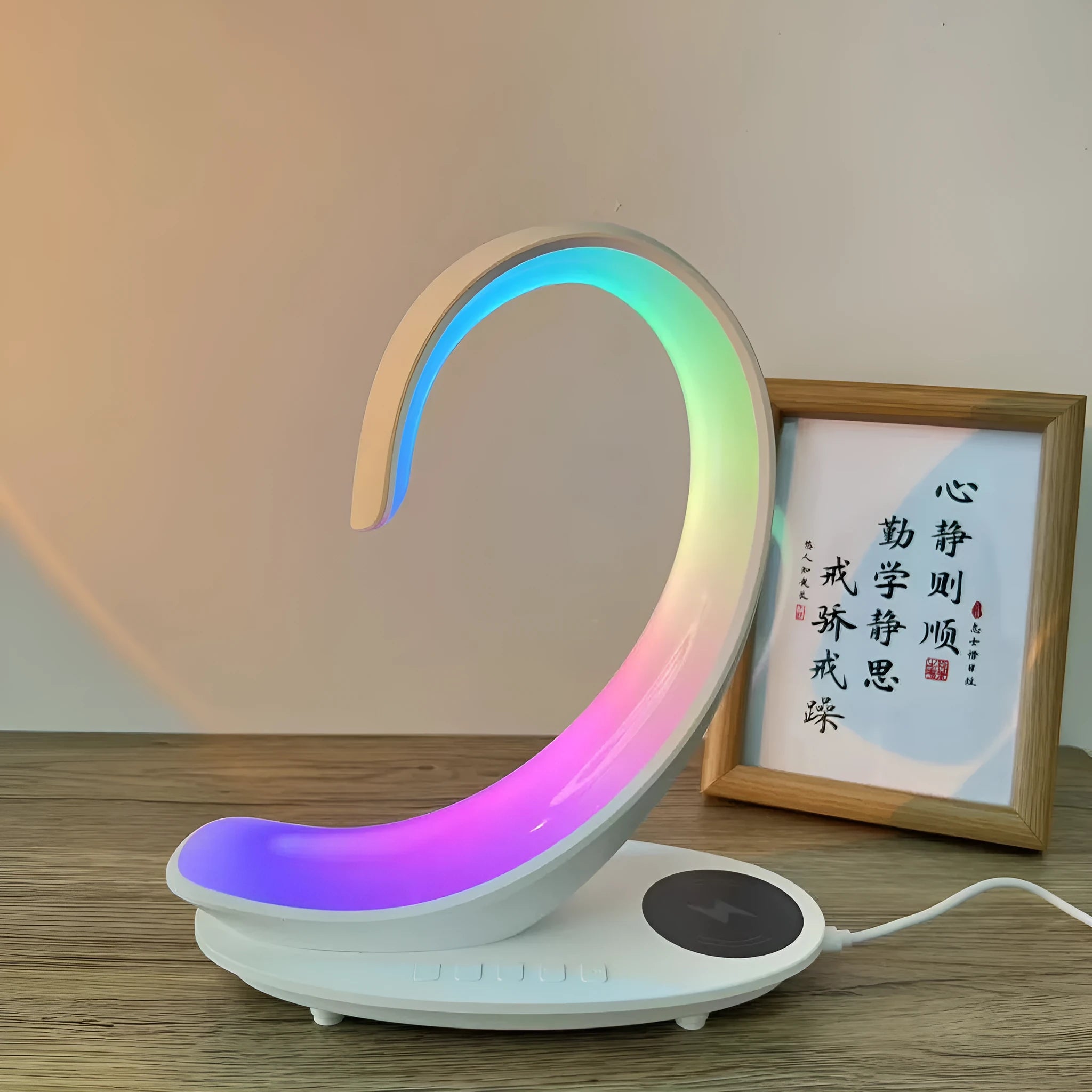 White swan shaped desk lamp with wireless charging pad, Bluetooth speaker and colourful LED lighting