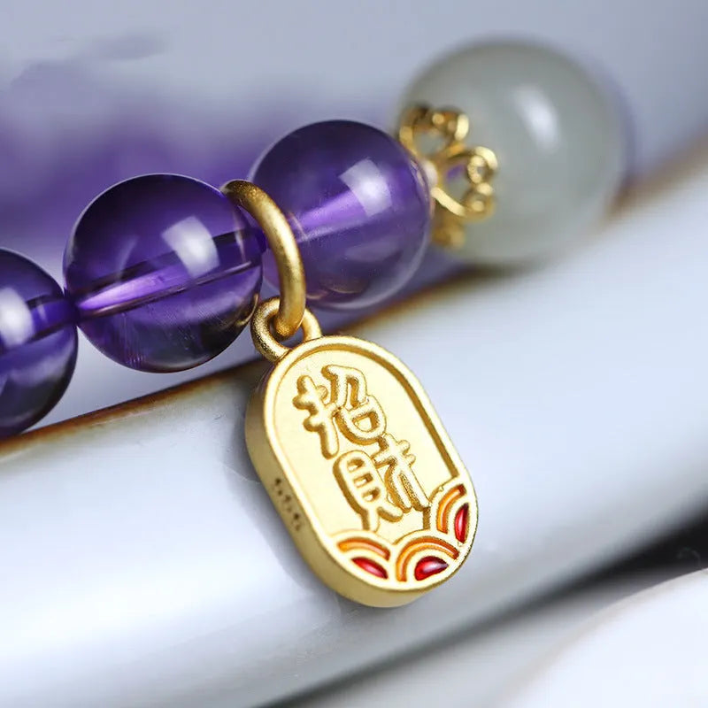 Close-up of a women's bracelet with purple amethyst crystal geometric beads measuring 8mm
