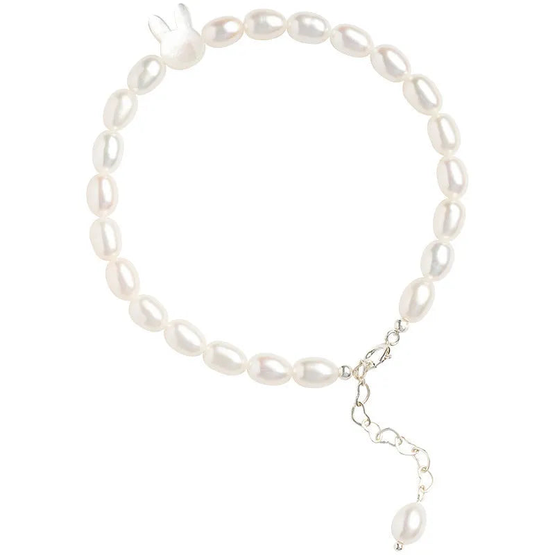 Handmade white shell pearl bracelet with 925 silver rabbit charm on 16cm elastic cord