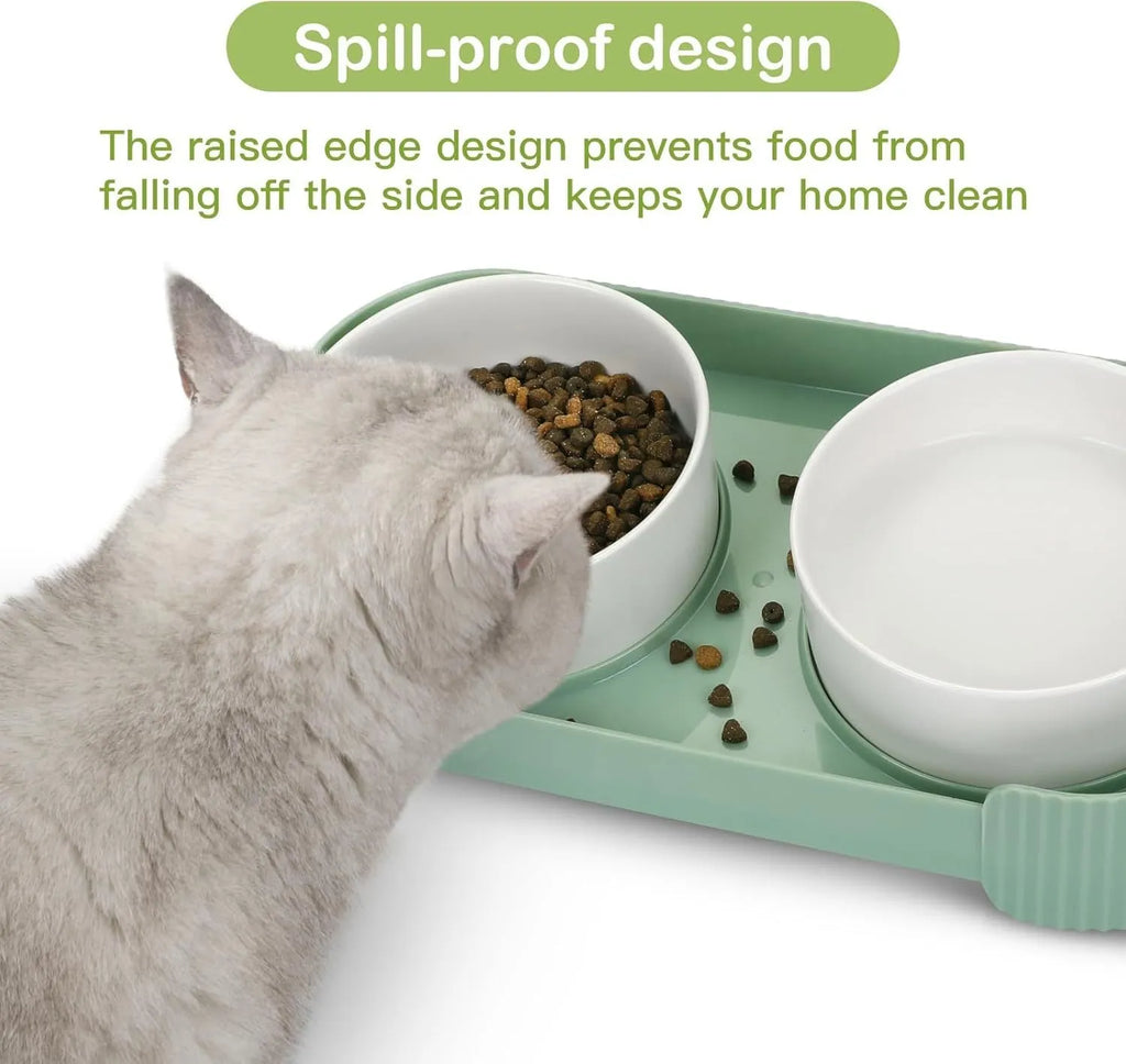 Green ceramic raised cat bowl set with two tilted bowls on non-slip base
