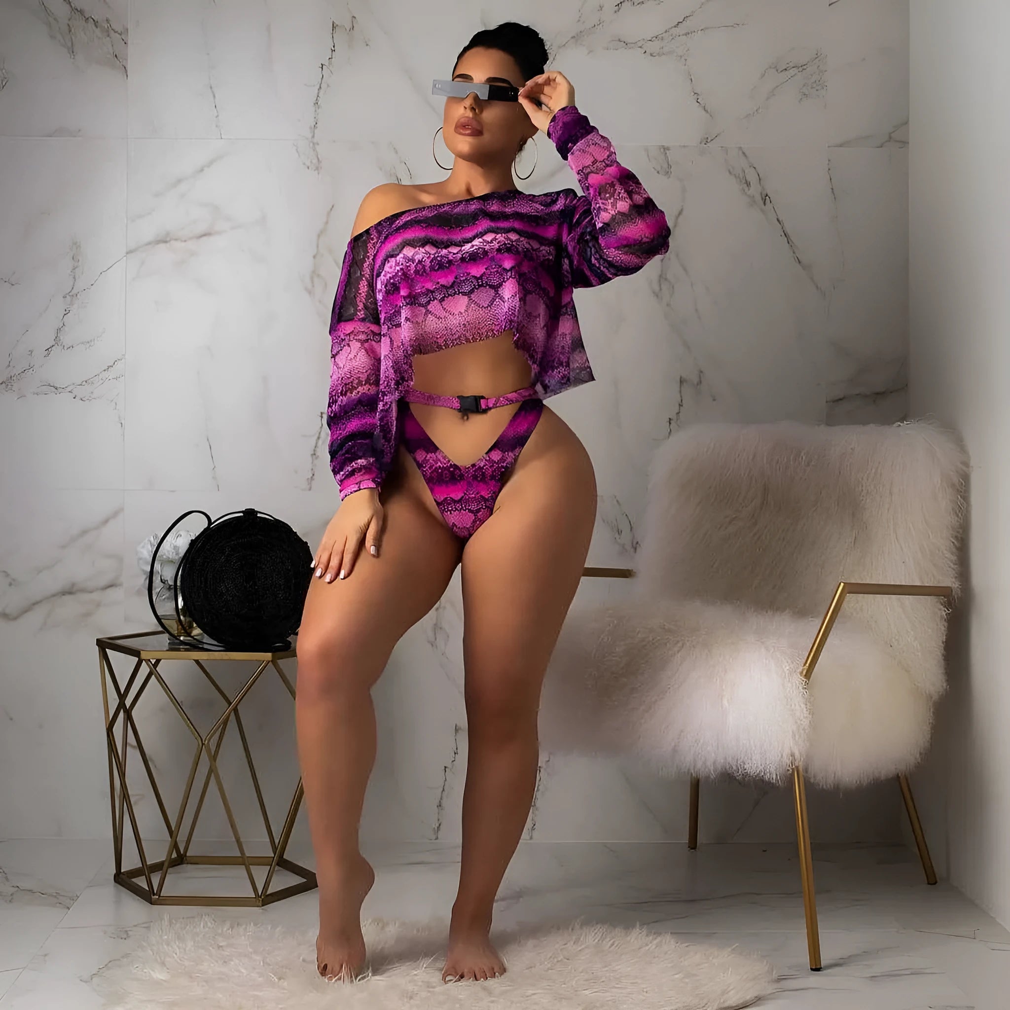 Women's purple snakeskin print bikini set with floral pattern and long sleeves.