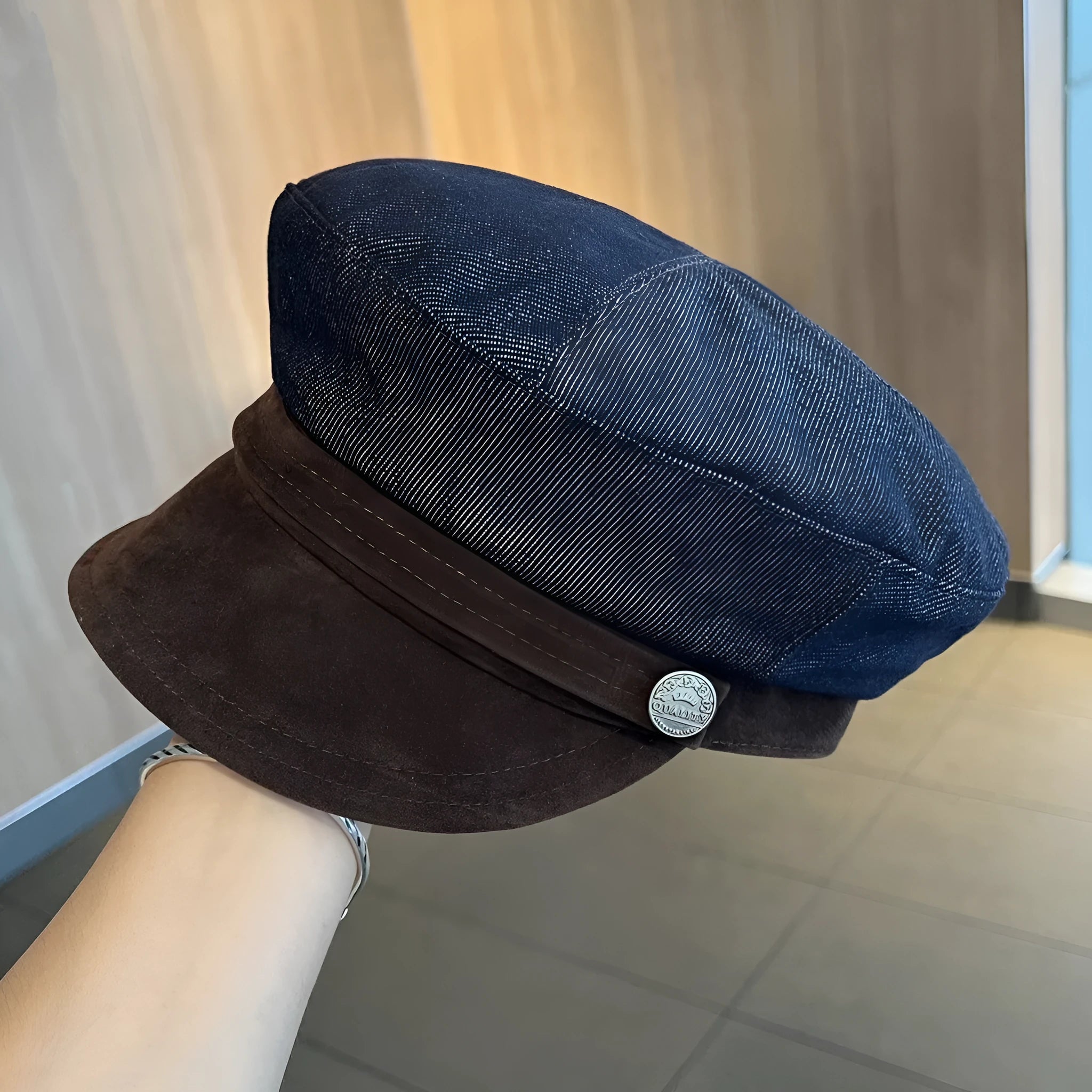 Dark blue denim octagonal newsboy hat with an adjustable fit for 54-58cm head sizes.