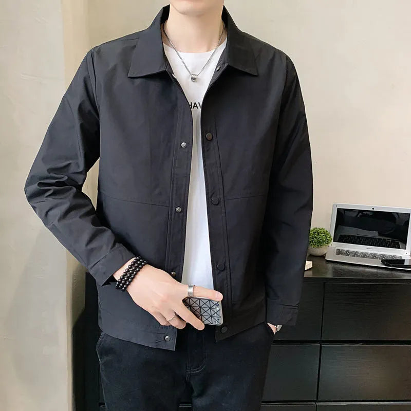 Man wearing a thin, grey, Korean-style long sleeve casual jacket for spring or autumn.