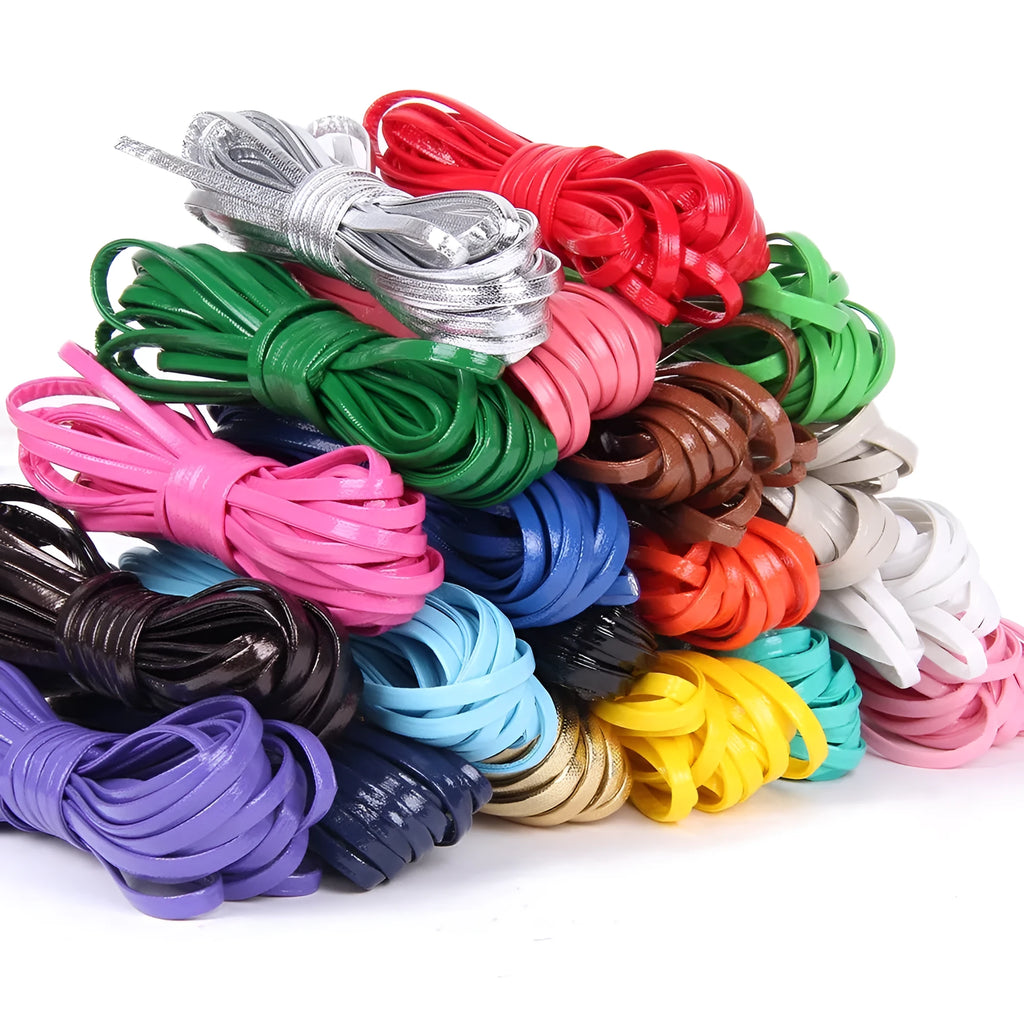 Spools of PU leather craft cord in multiple colours including black, gold, blue and red, showing fine and medium widths.