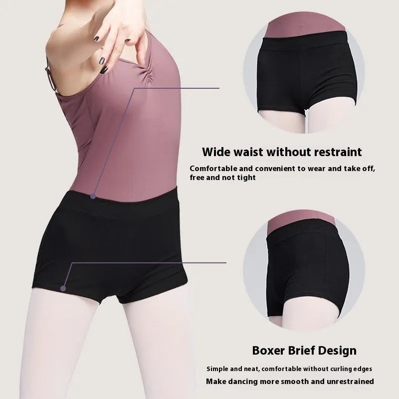 Black women's cotton dance practice shorts laid flat, showing solid colour and simple design.