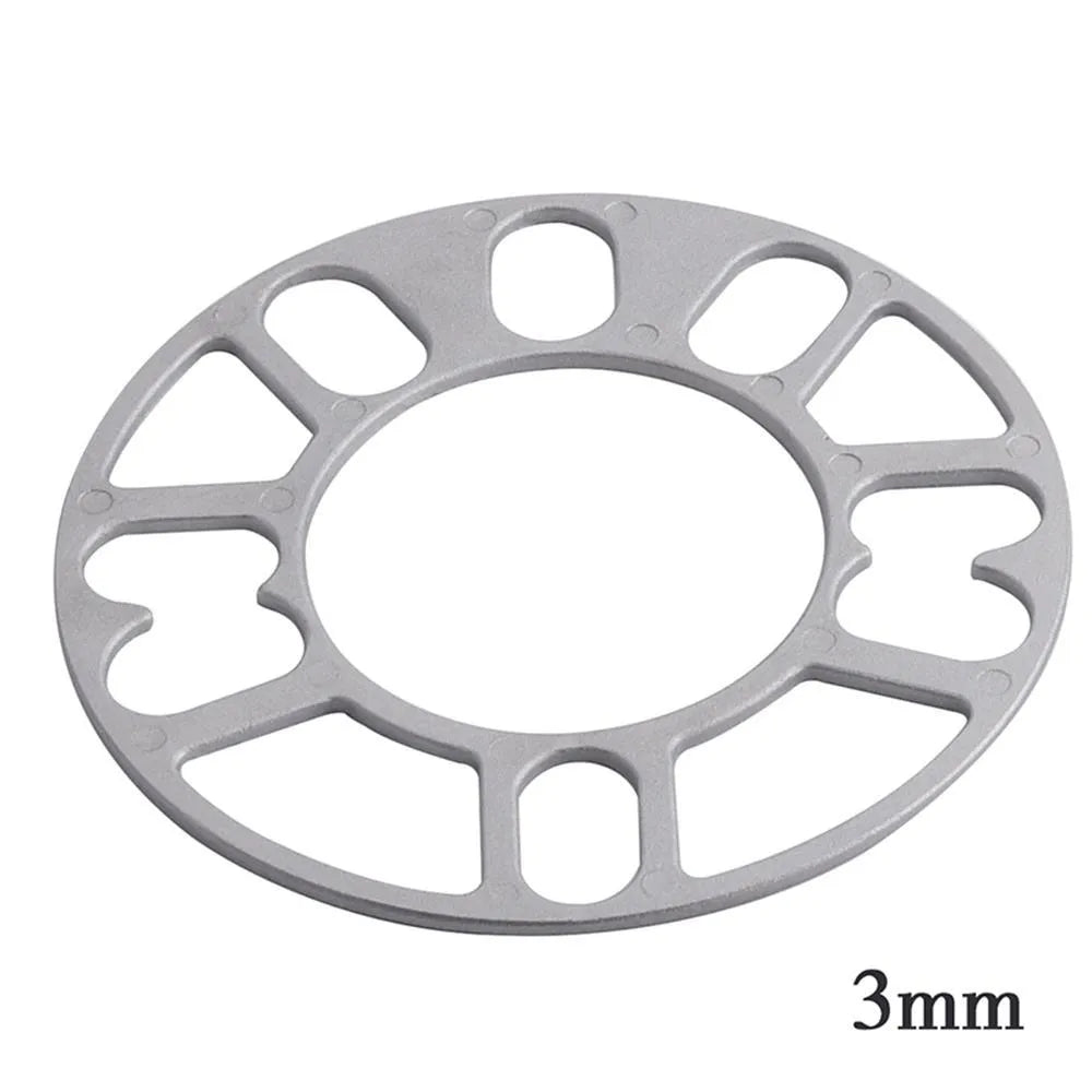 A single, solid metal wheel hub widening gasket or spacer for automotive brake clearance.