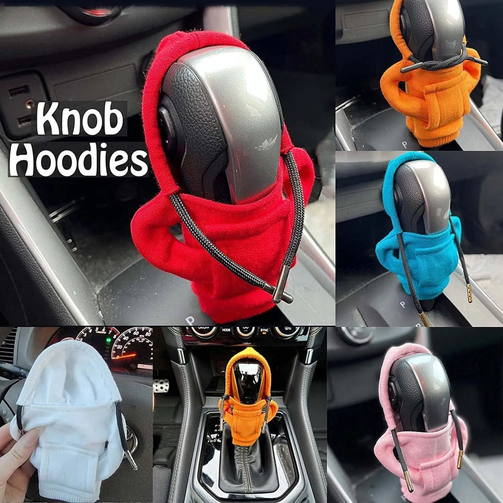 Blue cloth cover fitted over a car gear shift knob showing sewing detail