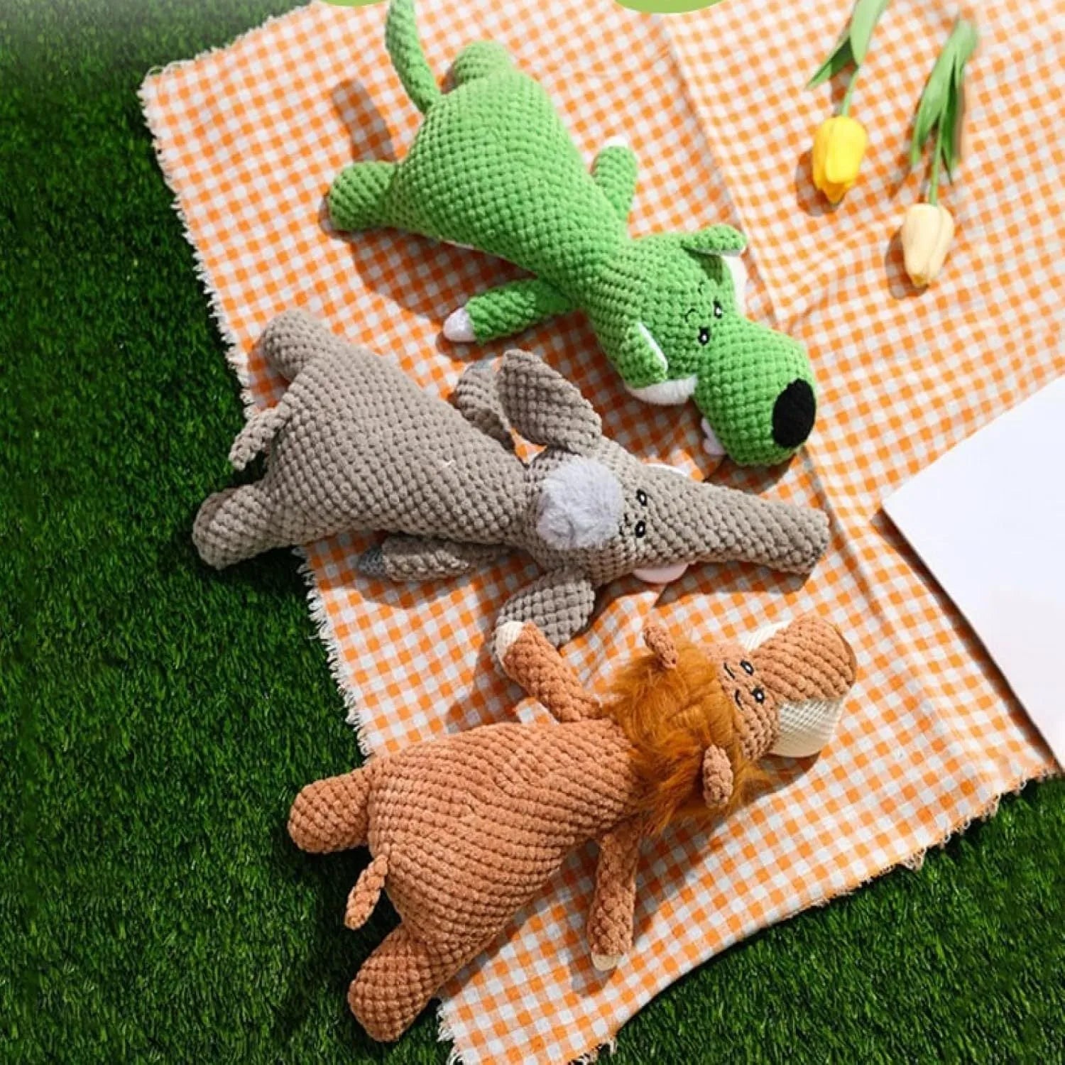 Corn kernel shaped plush dog chew toy with interactive sound feature in green colour