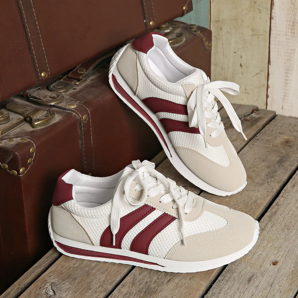Wine red Cortez Retro low-top sneakers with a cross-strap and breathable mesh panels.