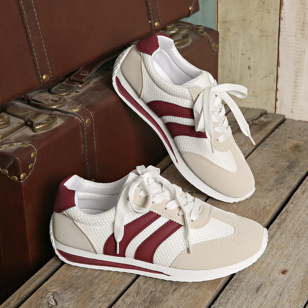 Wine red Cortez Retro low-top sneakers with a cross-strap and breathable mesh panels.