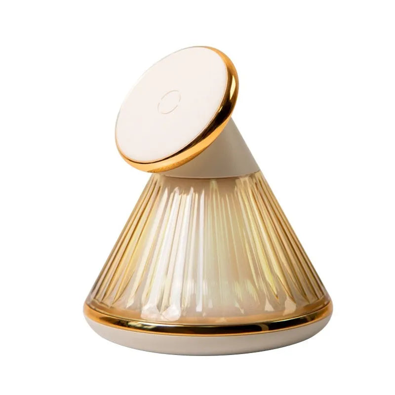 Night table lamp with wireless charging pad showing champagne gold finish and adjustable brightness controls