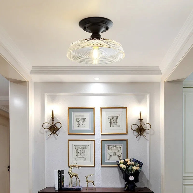 American retro single-head ceiling lamp with clear glass shade showing exposed filament style