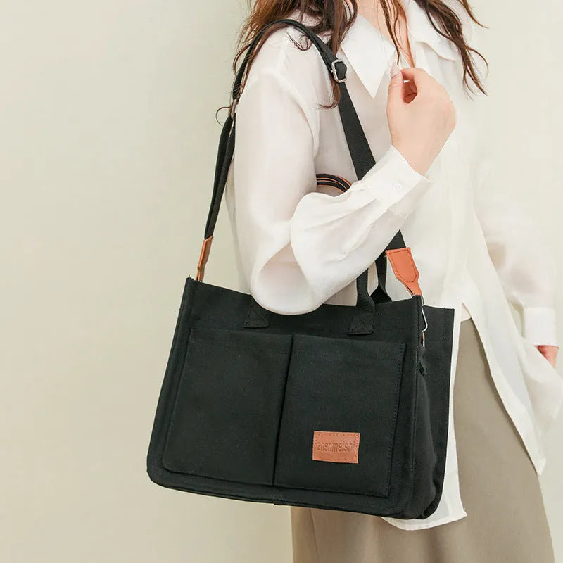 Large casual canvas tote shoulder bag for women with multiple pockets in creamy white