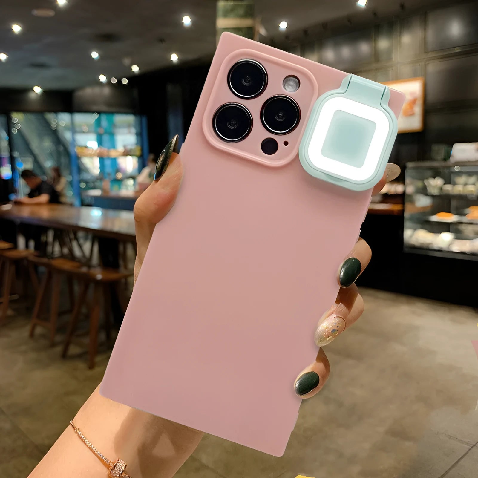 Ring flashing mobile phone case for iPhone 13 with solid colour back cover and integrated selfie light.