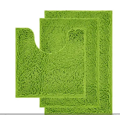 Dark green chenille U-shaped three-piece bathroom toilet carpet set on tiled floor.
