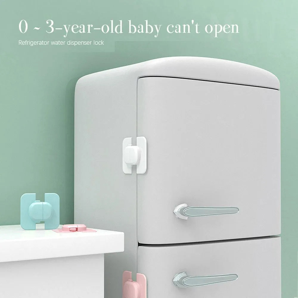 Grey and green adjustable child safety cabinet locks with adhesive backing on a kitchen drawer.