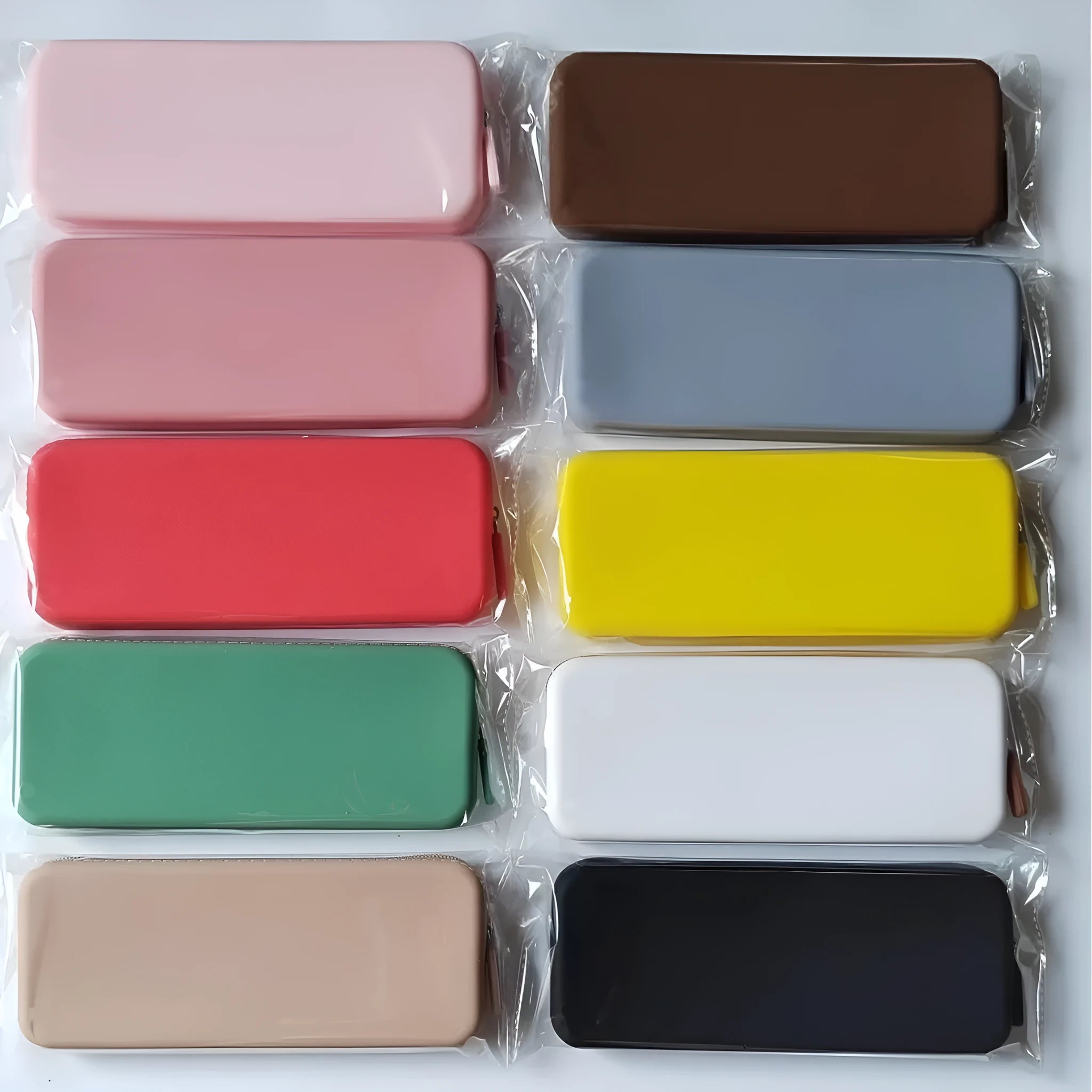 Slim silicone makeup brush storage bag in assorted colours, shown with brushes inside.