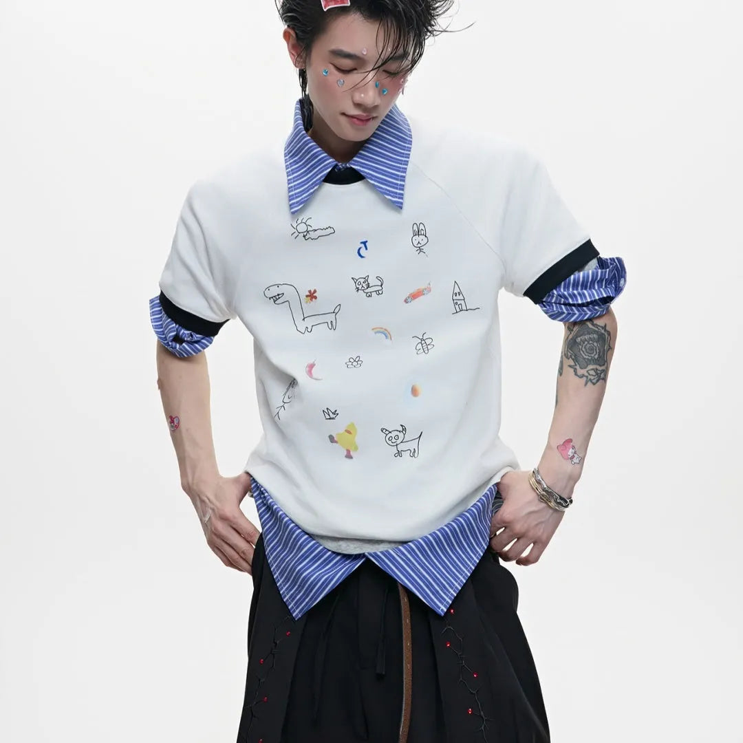 Man wearing a blue loose-fit short-sleeve shirt with a large cartoon print on the front.