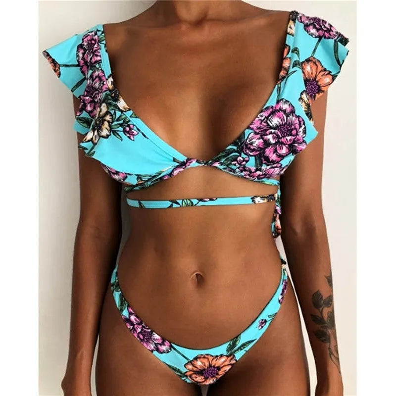 Yellow floral printed women's split bikini swimsuit on hanger showing front design