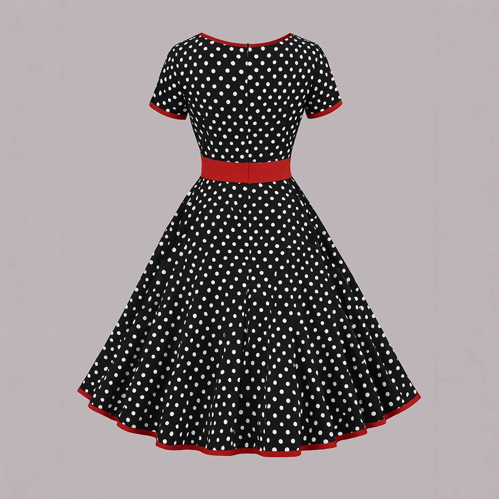 Multicolour polka dot dress with a square collar, short sleeves, front zipper, and pleated skirt.
