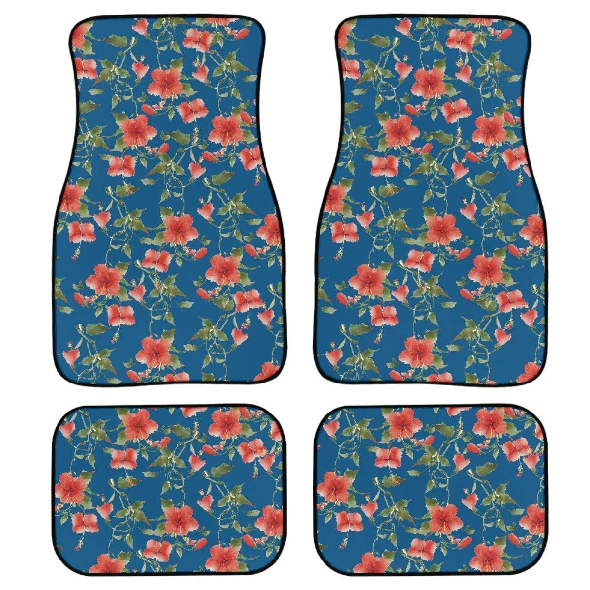 Set of four black printed rubber car floor mats with textured surface, showing thickness.