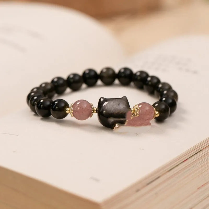 Black obsidian bracelet with 8mm stones and kitty charms on adjustable cord