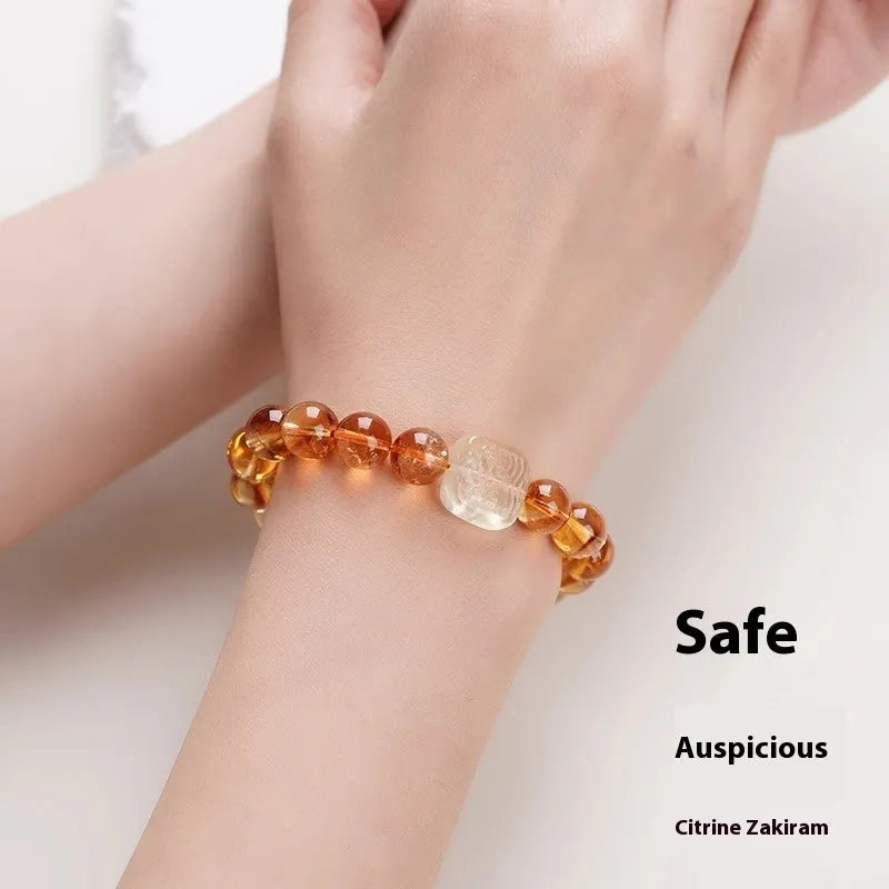 Women's carved citrine bracelet with geometric ethnic patterning, 10mm crystal construction